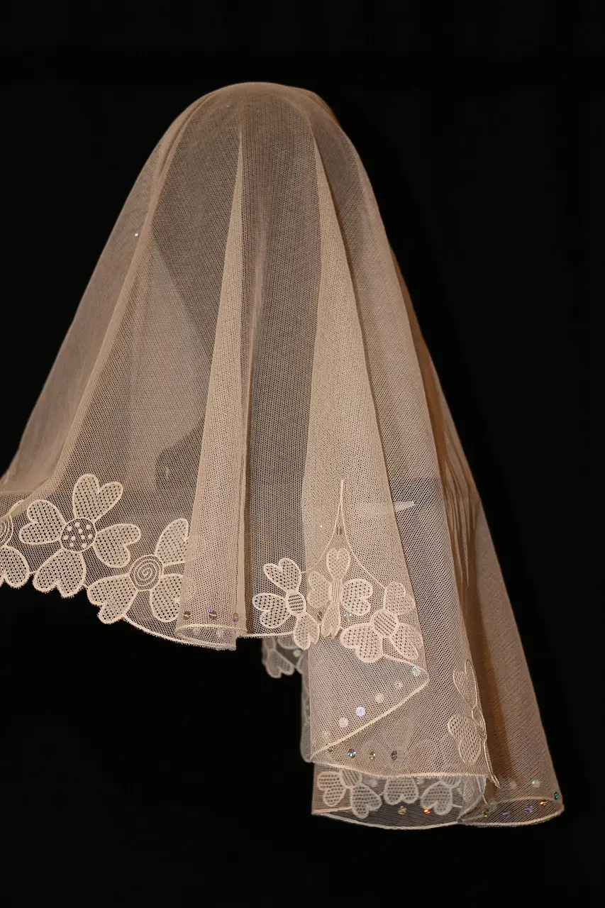 What is the significance of the cravate or bridal scarf in a French wedding?